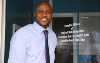 Owner Albert Williams in front of Best Deal Executive Offices