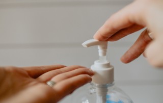 Hands and hand sanitizer pump. Photo by Kelly Sikkema from Unsplash.com